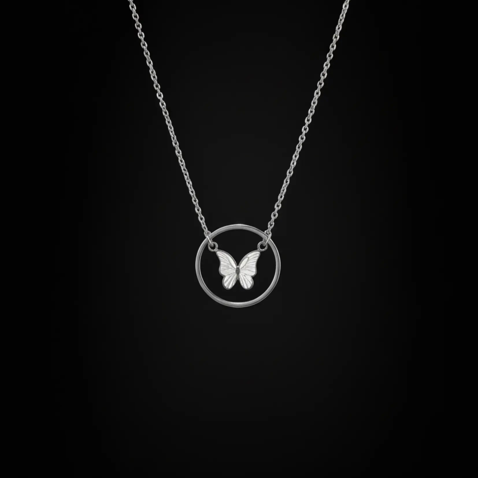 Shinora Midnight Fly Pendant – silver butterfly necklace with circular charm on black background, perfect for modern women from Shinora