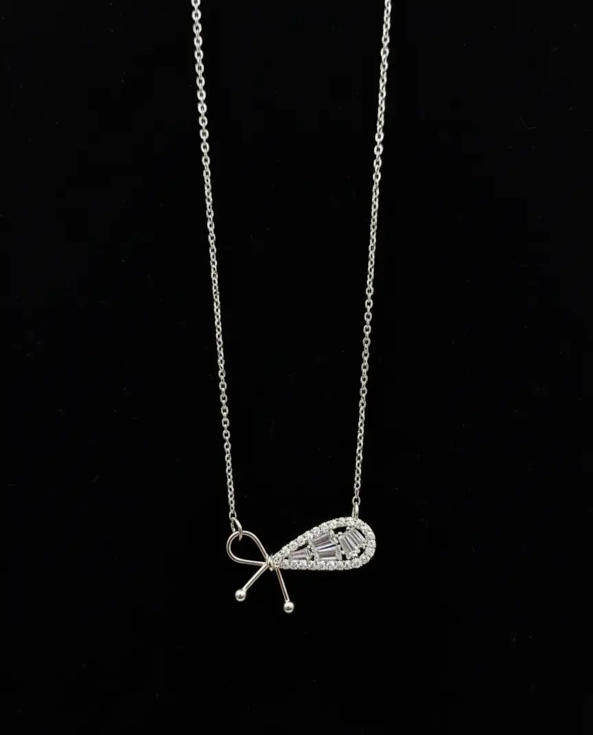 Shinora Lumina Bow Pendant – elegant silver bow necklace with sparkling stones, symbolizing beauty and femininity from Shinora