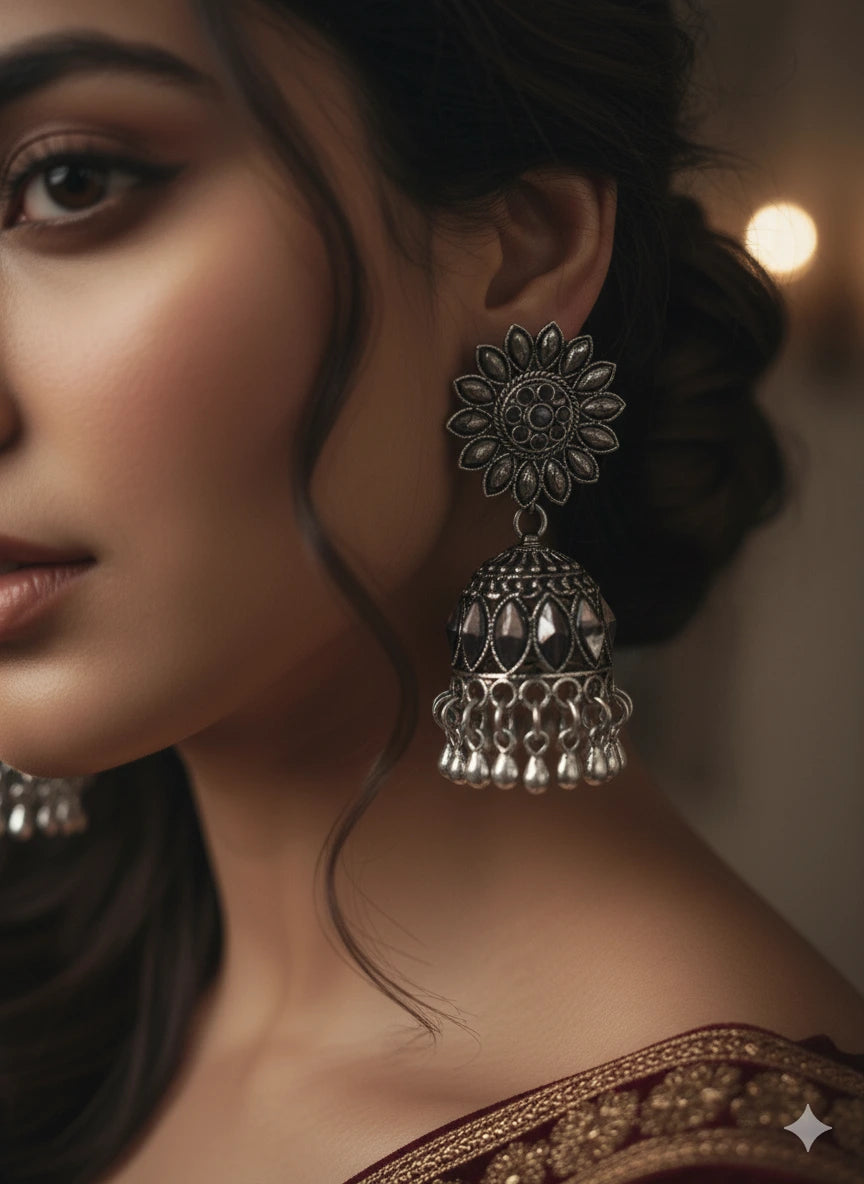 Stylish model showcasing Aakriti Jhumka – antique silver earrings with classic ethnic craftsmanship by Shinora.