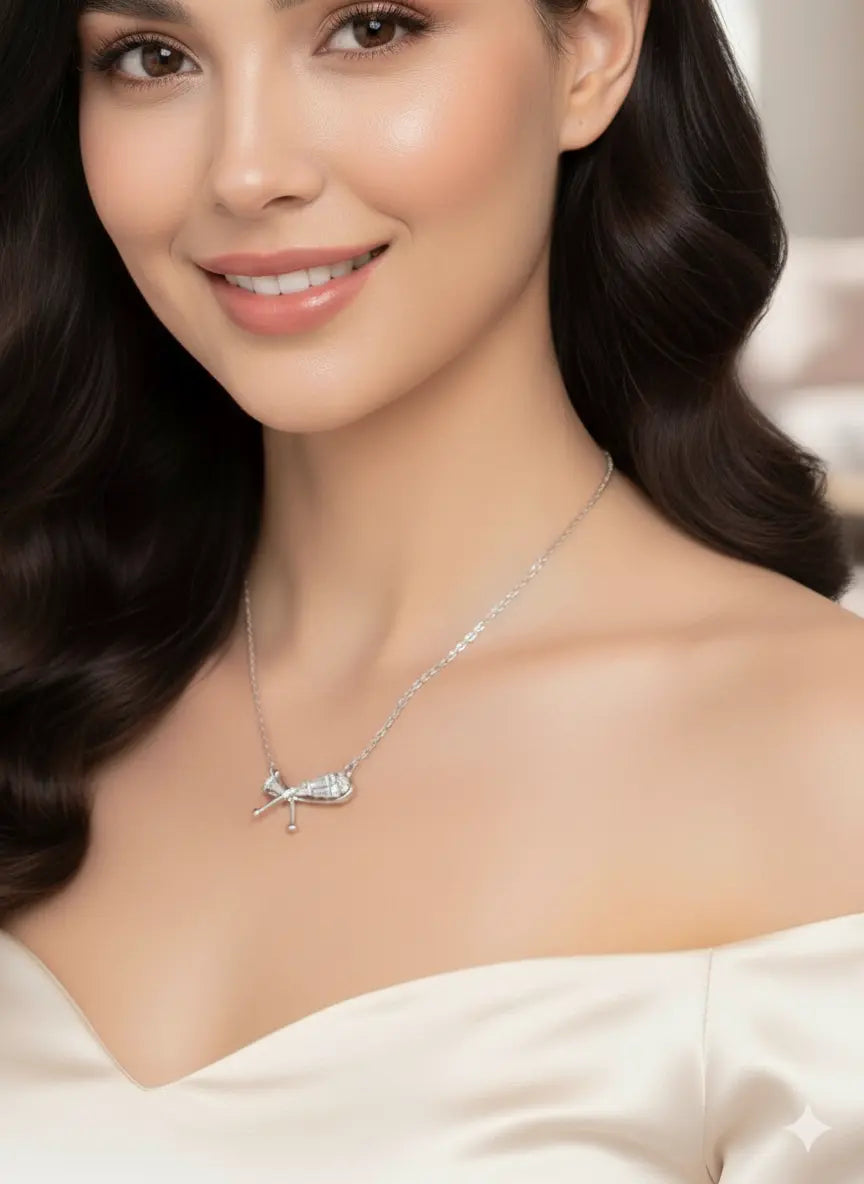 Shinora Lumina Bow Pendant – elegant silver bow necklace with sparkling stones, symbolizing beauty and femininity from Shinora