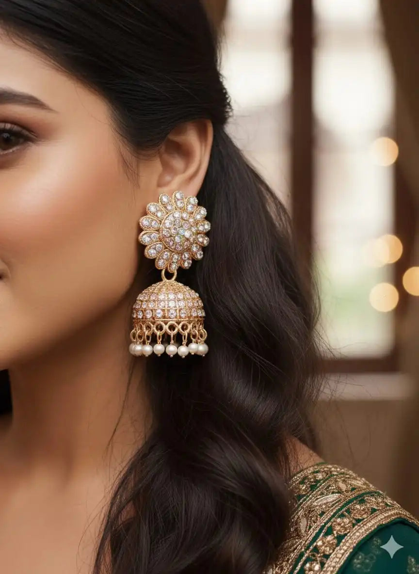 Close-up of model wearing Noor Jhumka – rose-gold floral studded jhumka earrings with pearl danglers from Shinora