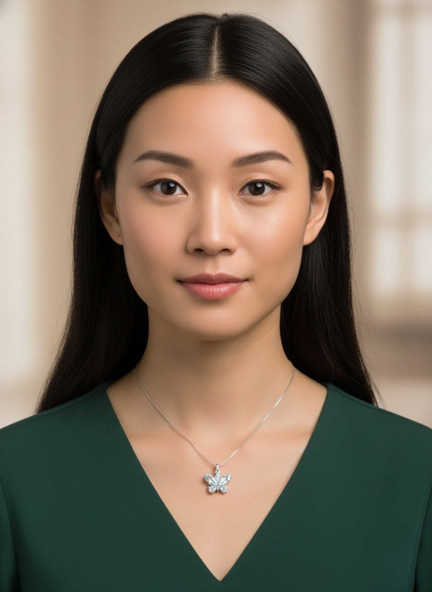 Elegant woman wearing The Fluttering Charm silver butterfly necklace with sparkling crystal stones, styled with a deep green   by shinoradress.