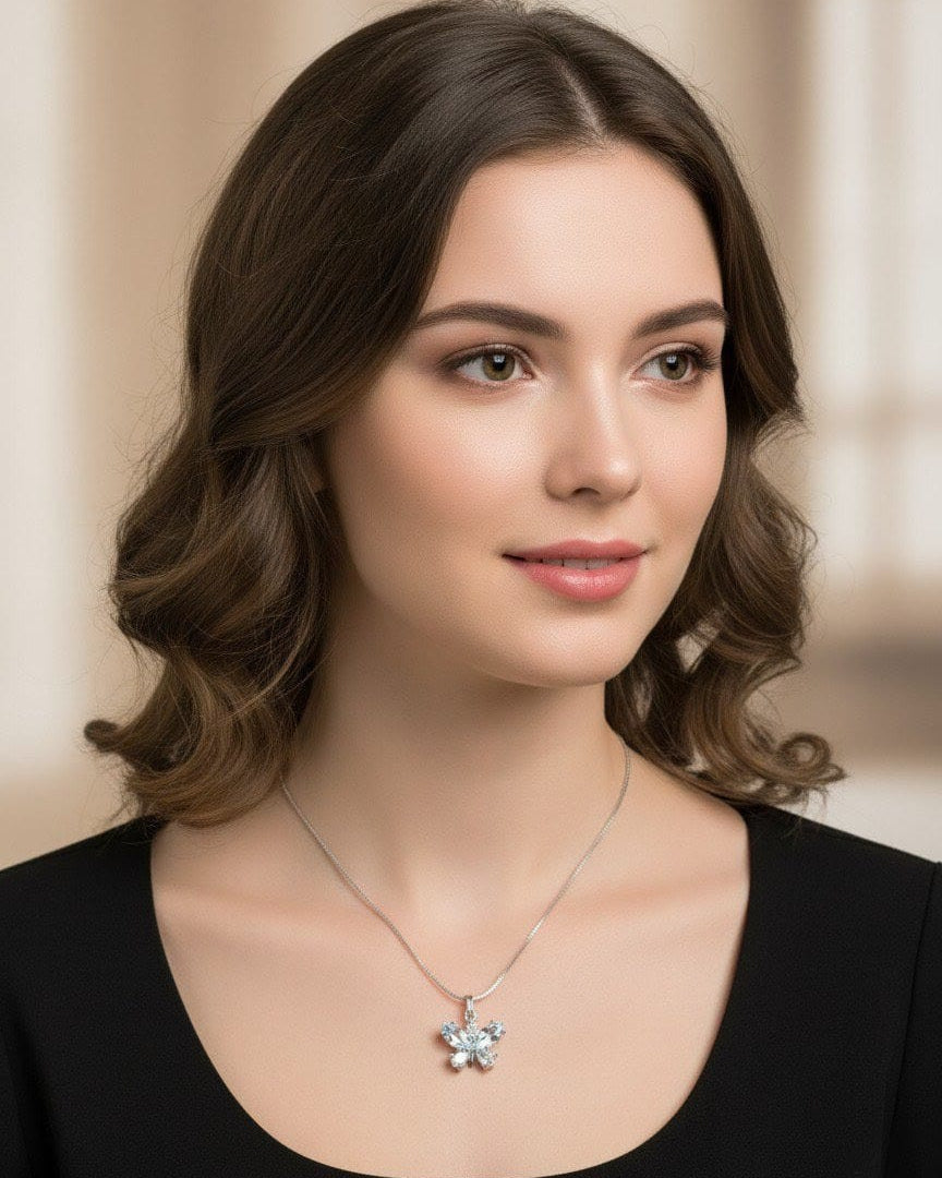 Model showcasing The Fluttering Charm butterfly pendant necklace in silver and crystal stones, paired with a black outfit for a classic look by shinora