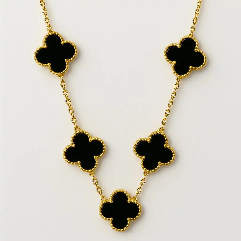 Gold and black clover necklace on a clean white background showing anti-tarnish finish and detailed craftsmanship from shinora