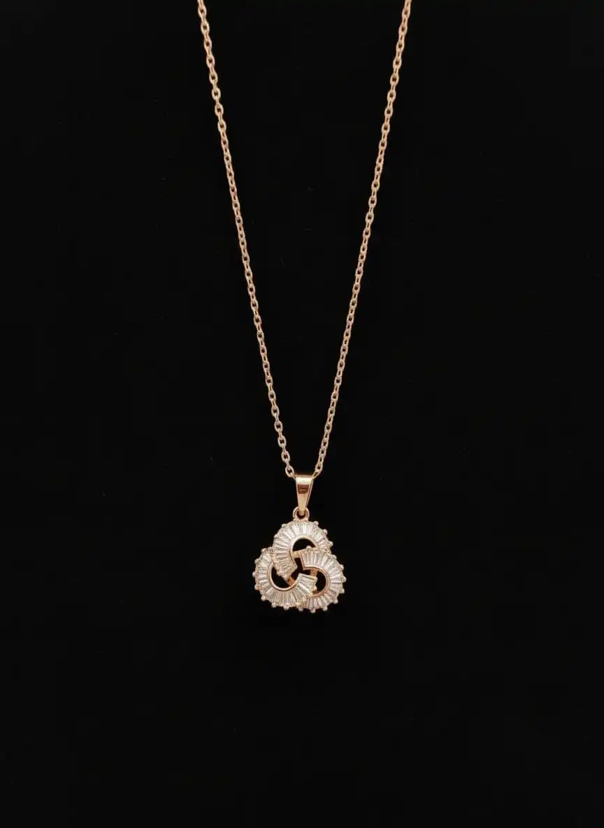 Shinora Momentum Pendant – elegant gold-plated swirl necklace with crystal accents symbolizing strength and motion from Shinora