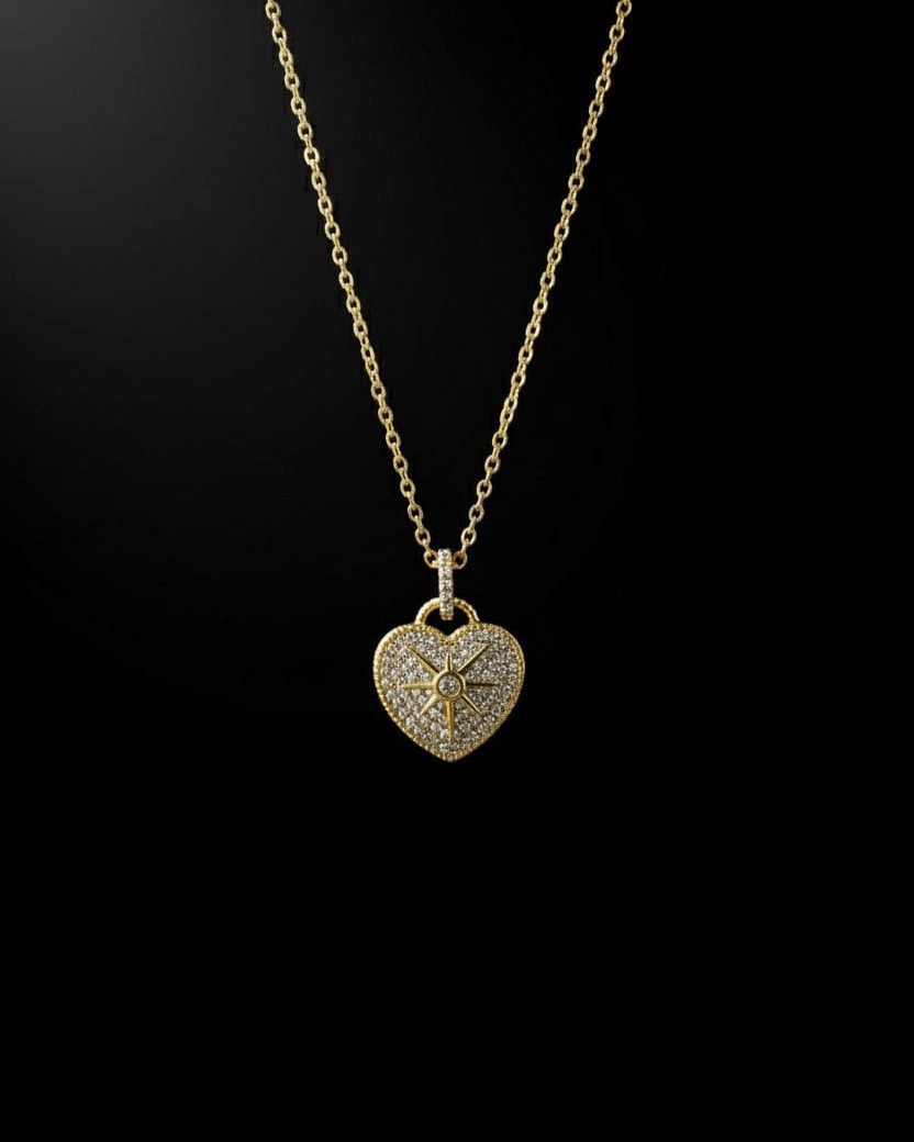 Model wearing the Aurum Heart Necklace with a deep blue satin gown – elegant gold heart pendant perfect for evening wear from Shinora